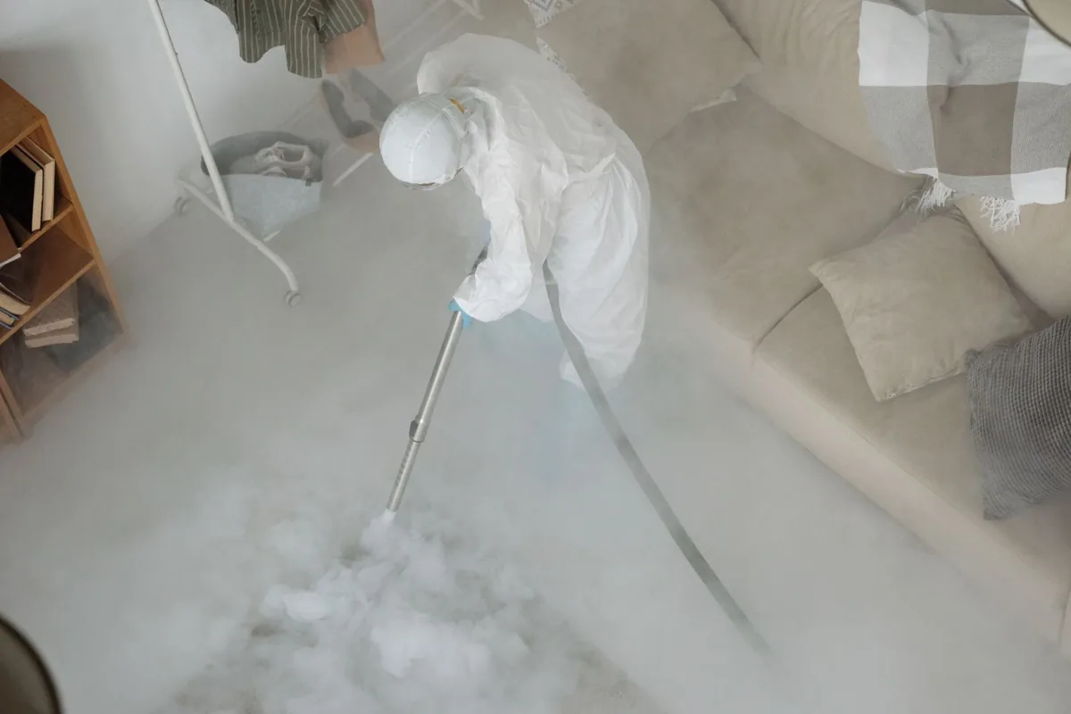 Biohazard cleanup technician in protective equipment, Woodburn, OR